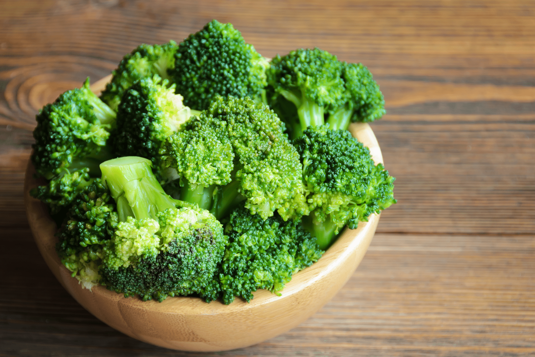 photo of a metal bowl with broccoli in it