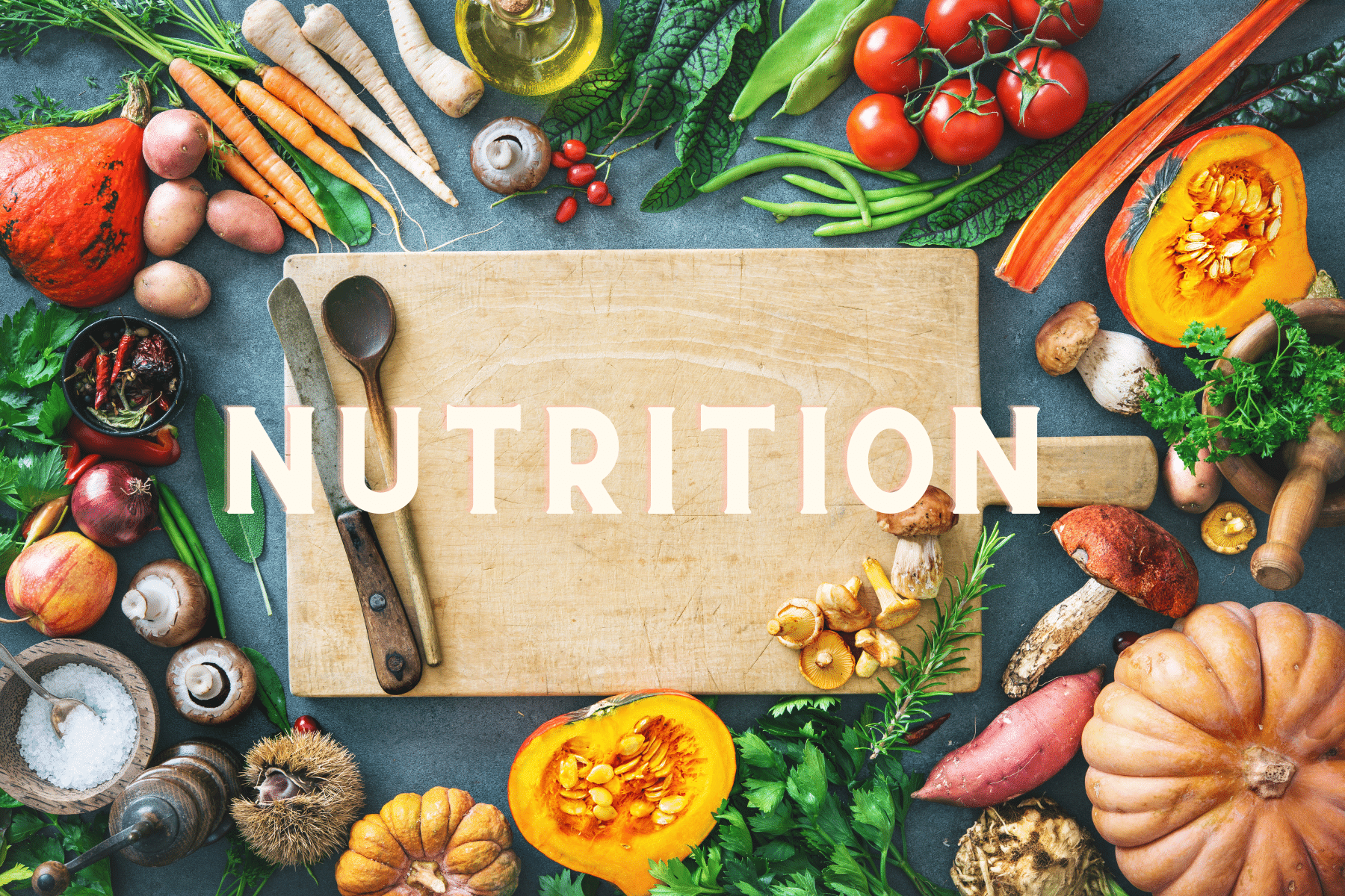 the word nutrition surrounded by different fruits and vegetables
