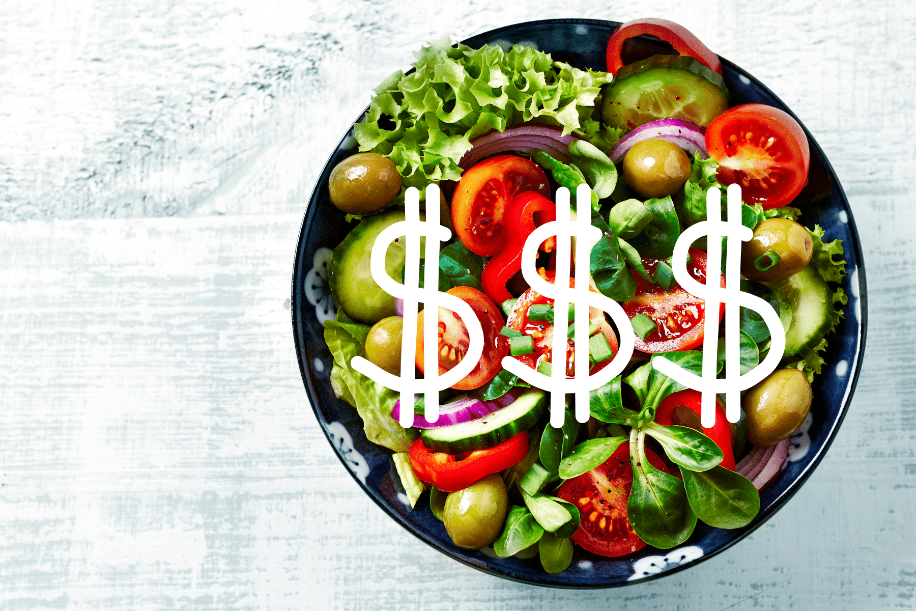 picture of a salad and the tomatoes are dollar signs.